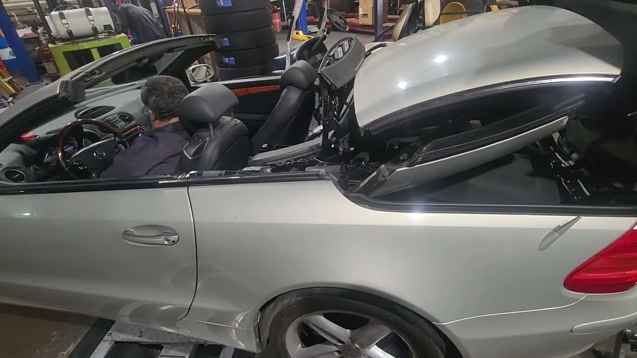 A European convertible raised on a lift inside the ESS shop
