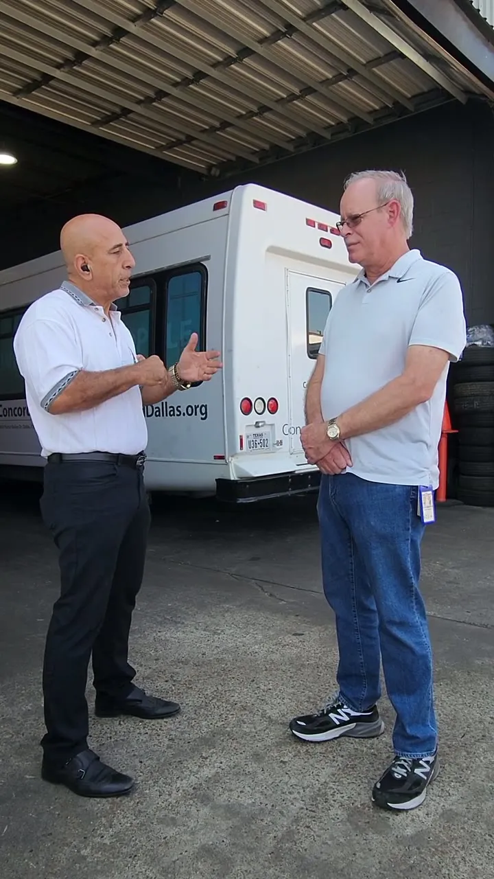 ESS president Malek Samadian talking with WFAA Channel 8 fleet manager Shaun Zurbrick beside a client van